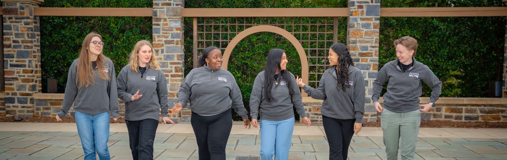 Next Step Advisers walking and talking to each other