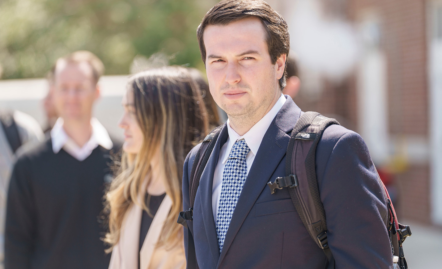 person wearing suit during class discussion