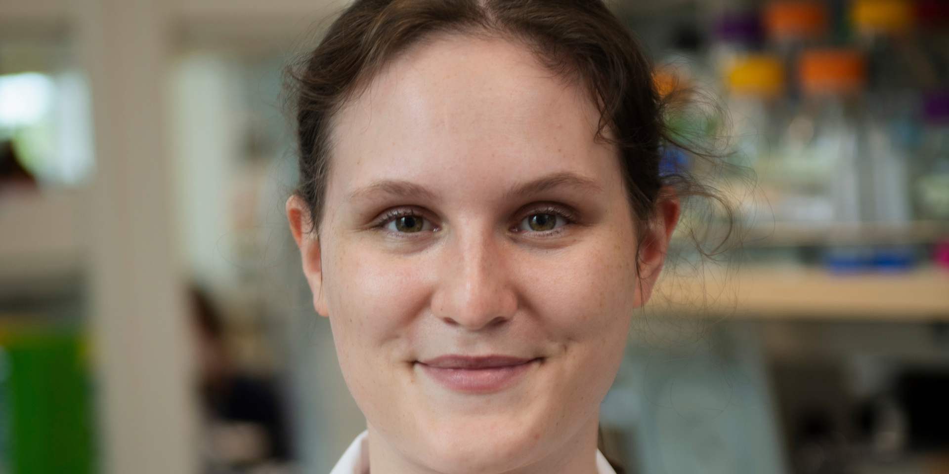 Portrait picture of a Chemistry student in a lab coat