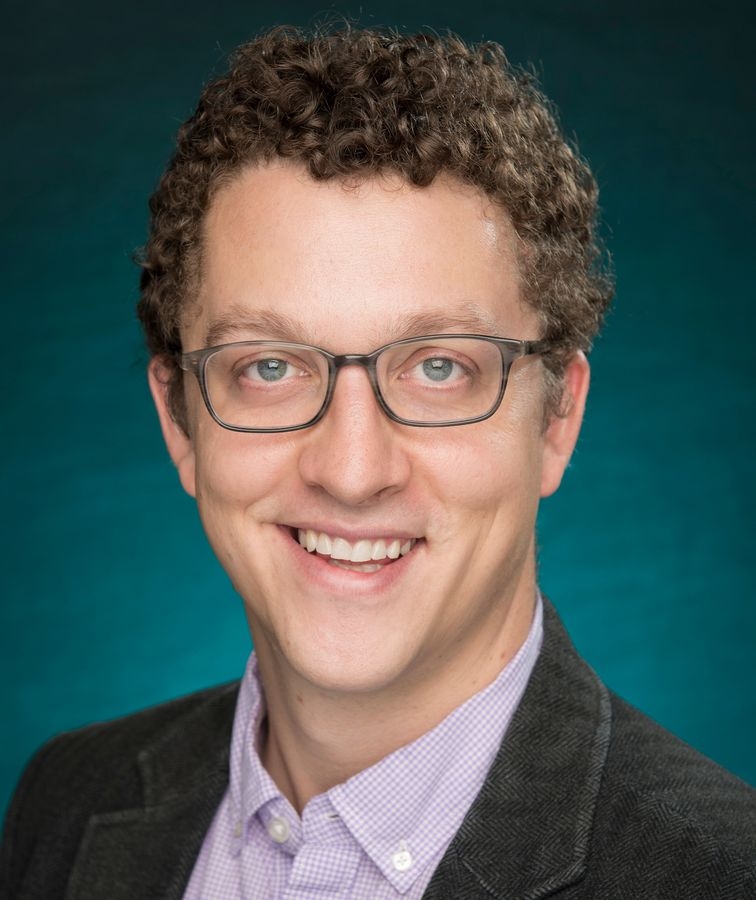 Male faculty member smiling in portrait