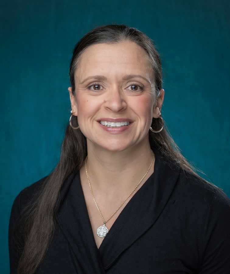 female faculty member smiling in portrait