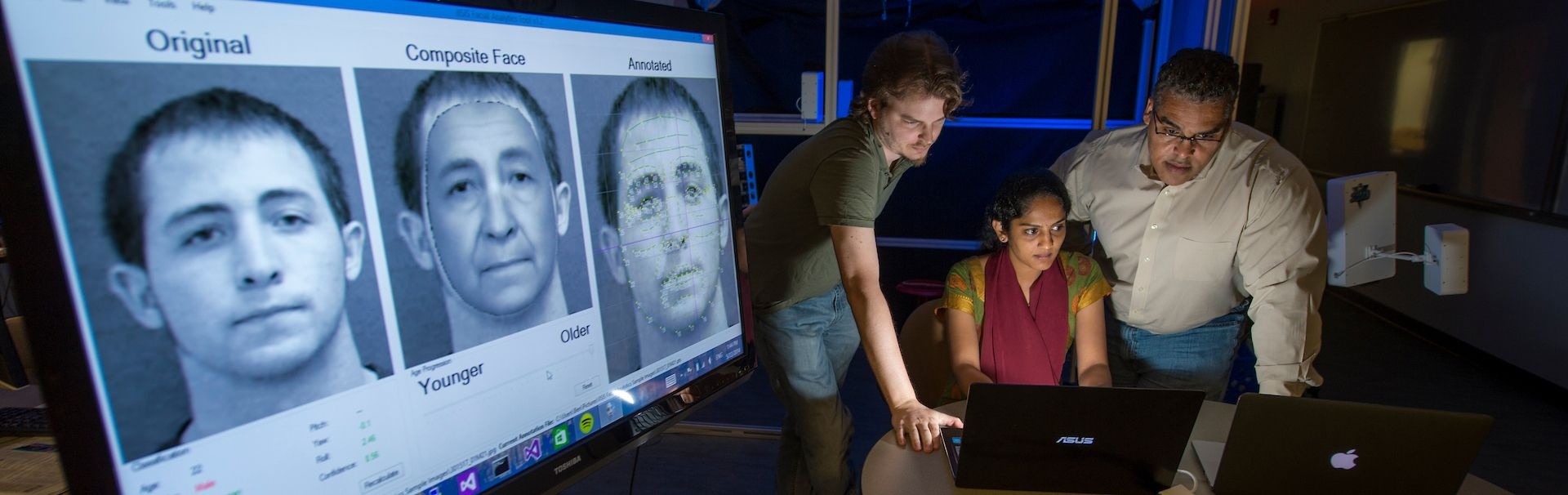 UNCW professor Dr. Karl Ricanek (right) works with his team of research associates Ben Barbour and Amrutha Sethuram developing and creating software to help with facial recognition for government bureaus such as the FBI.