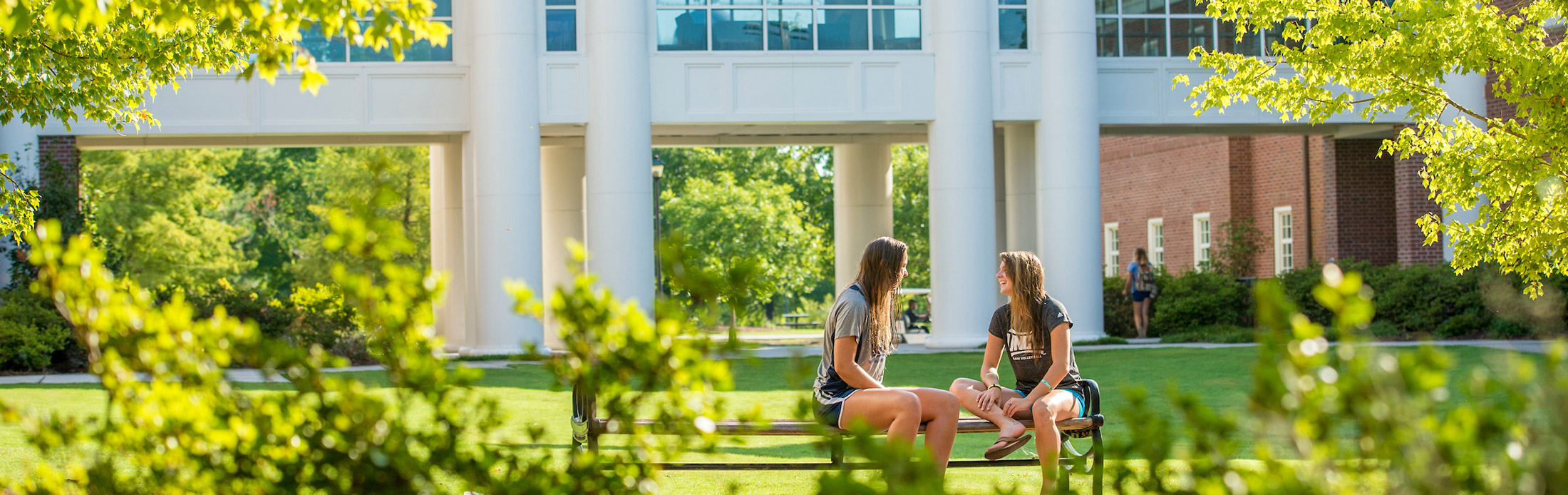 Two people talking at Student Affairs CourtyardQuad