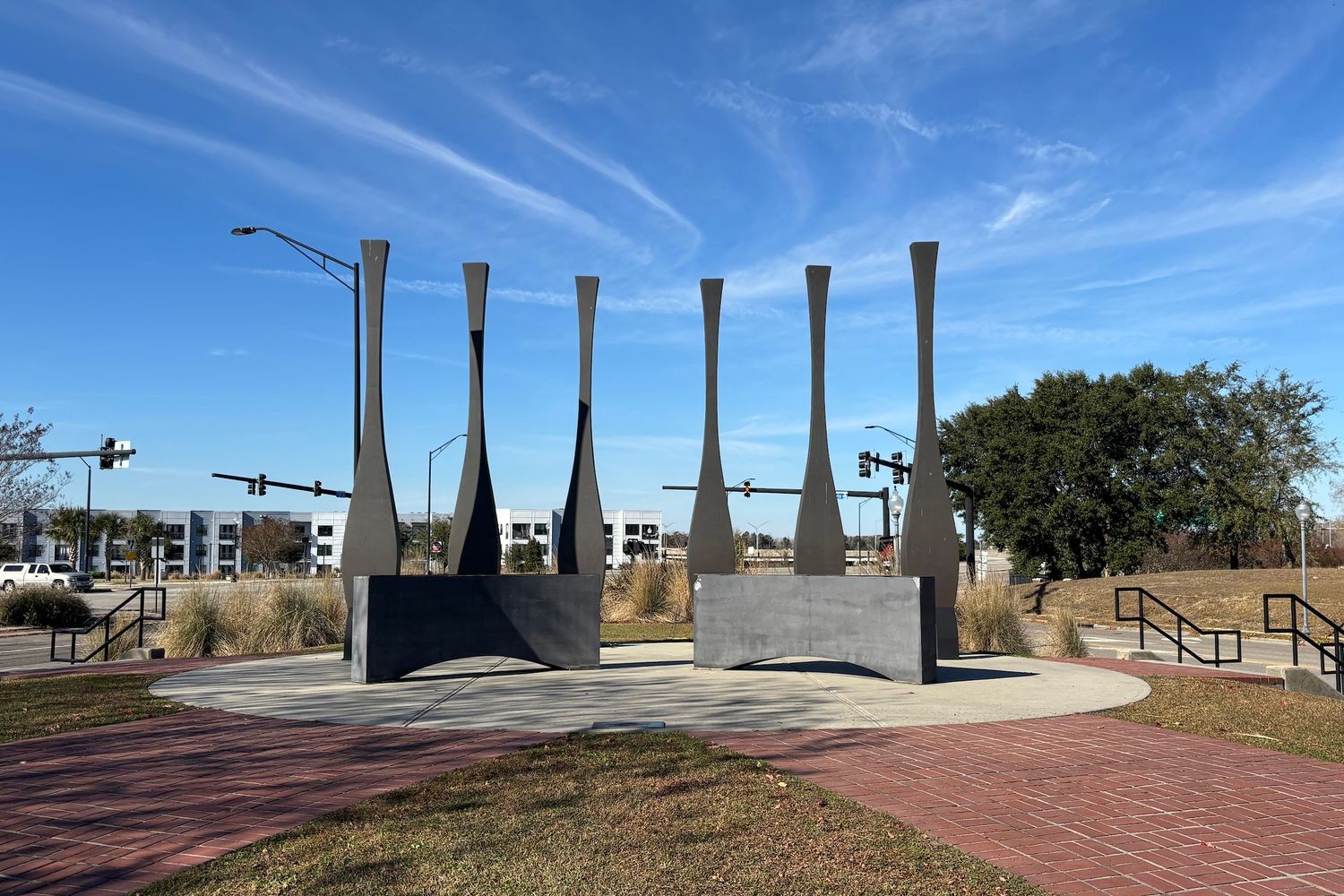 Tall, iron sculptures in a courtyard