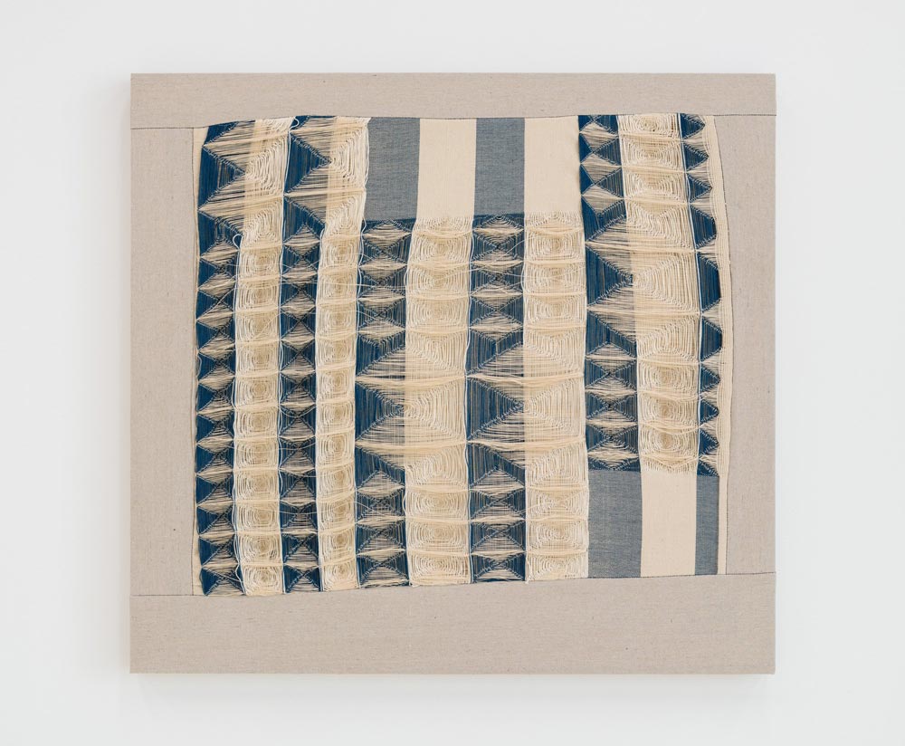 Image of Warped Grid, a textile art piece that is white and blue