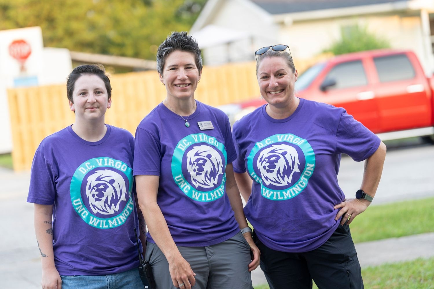 Social Workers greeting students for class