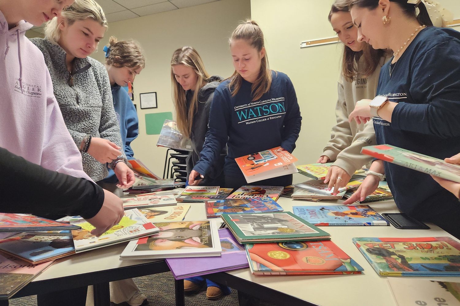 Participants looking at books at the book fair