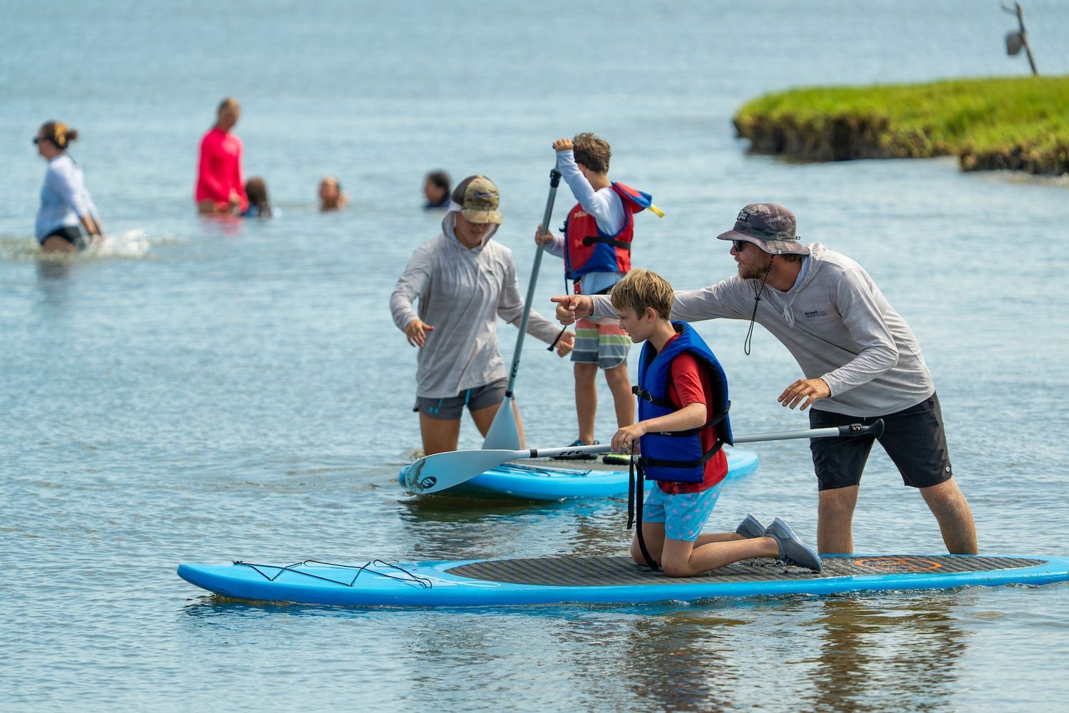 Marinequest students learn Paddleboarding and fish netting along the Cape Fear river basin as part of their Summer Camp.