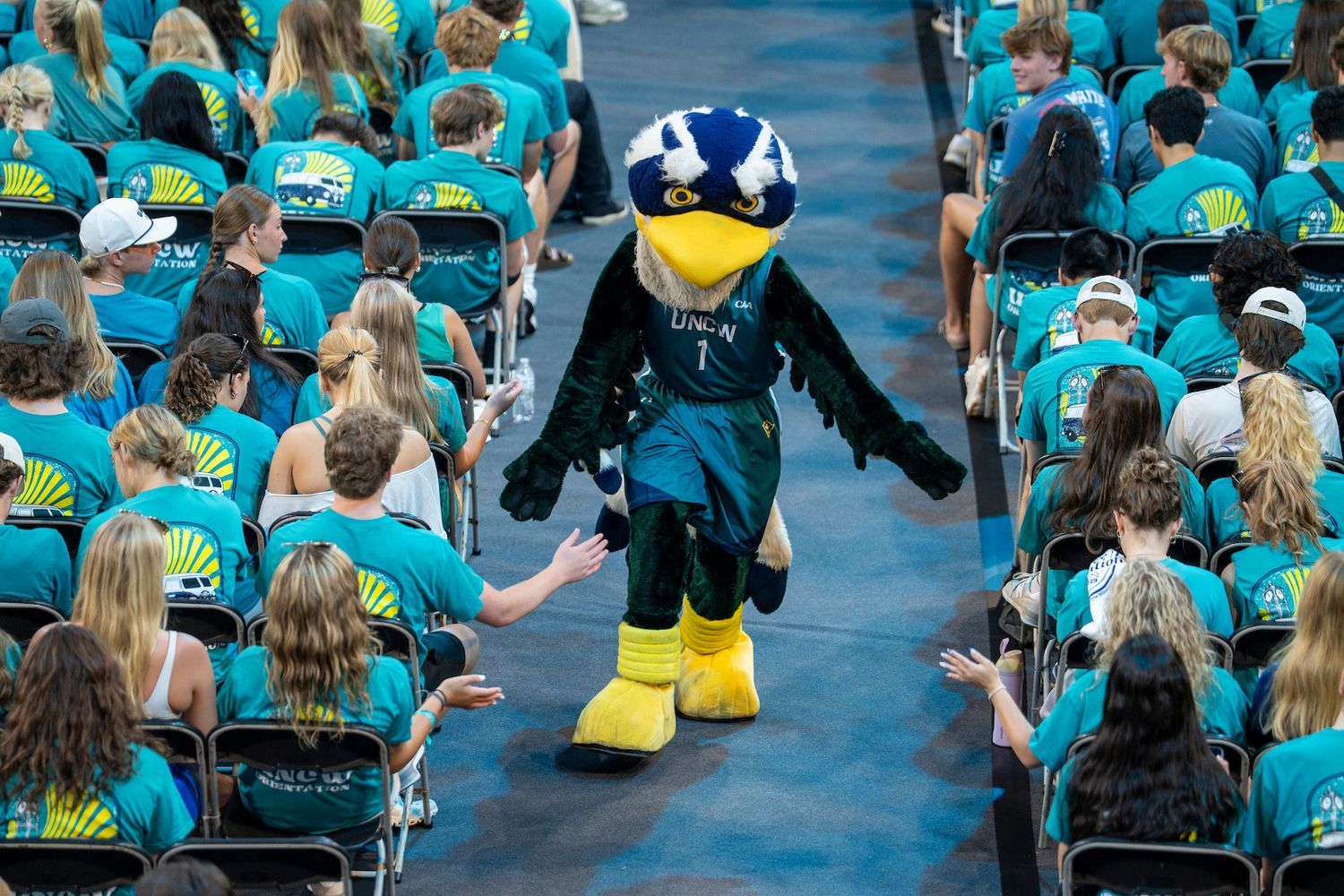 Sammy C. Hawk greets students during Convocation
