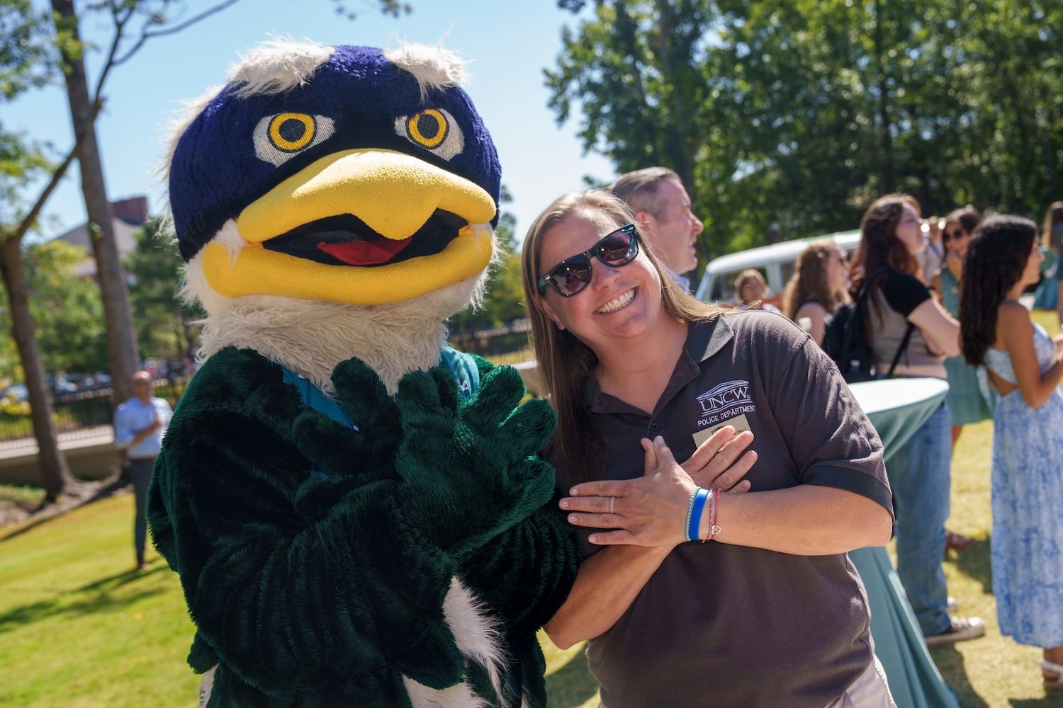 Staff Senate Chair posing with Sammy the Seahawk Mascot